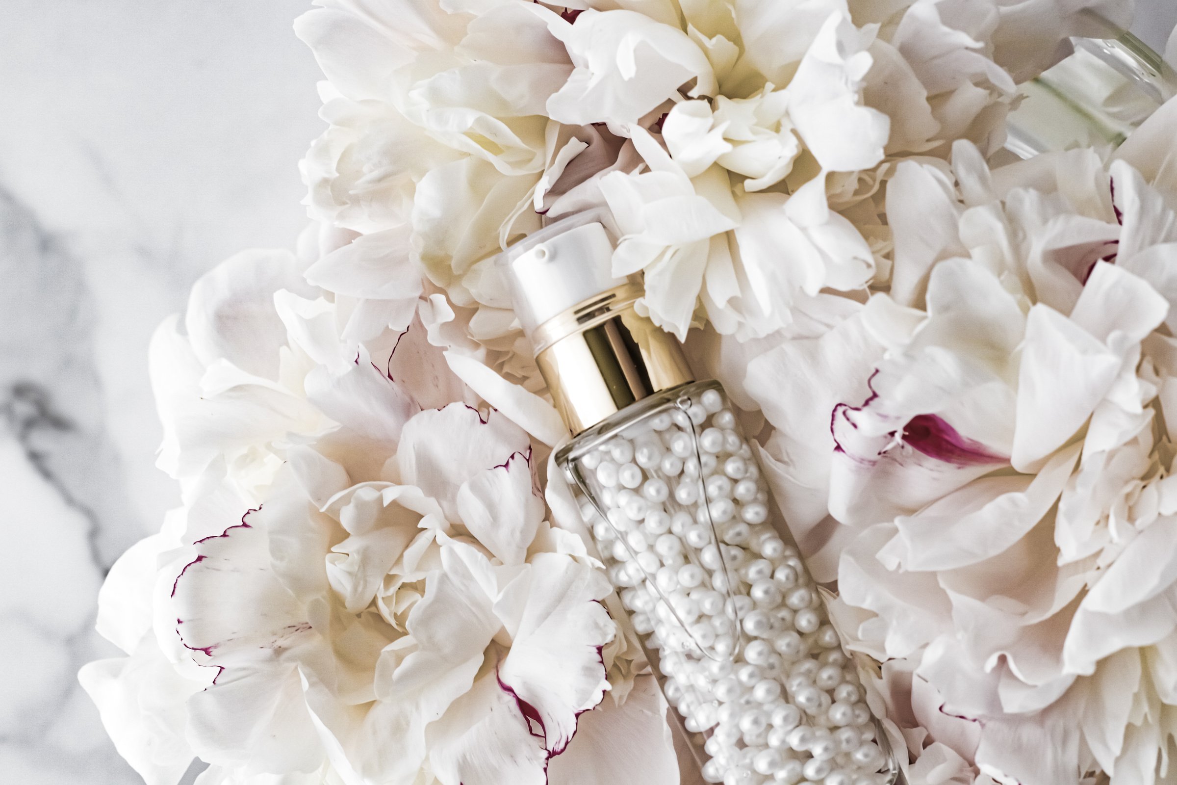 Luxurious Cosmetic Bottle with Pearls and Flowers